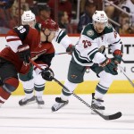 Minnesota Wild's Jason Pominville (29) battles Arizona Coyotes' Mikkel Boedker (89), of Denmark, for the puck during the first period of an NHL hockey game Thursday, Oct. 15, 2015, in Glendale, Ariz. (AP Photo/Ross D. Franklin)