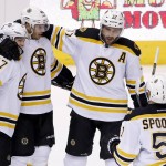 Boston Bruins' David Krejci (46), of the Czech Republic, celebrates his goal against the Arizona Coyotes with Torey Krug (47), Patrice Bergeron (37) and Ryan Spooner (51) during the second period of an NHL hockey game Saturday, Oct. 17, 2015, in Glendale, Ariz. (AP Photo/Ross D. Franklin)