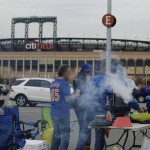 New York Mets fans tailgate before Game 4 of the Major League Baseball World Series against the Kansas City Royals Saturday, Oct. 31, 2015, in New York. (AP Photo/Julie Jacobson)