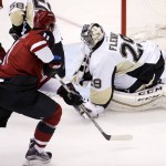 Pittsburgh Penguins' Marc-Andre Fleury (29) makes a save on a shot by Arizona Coyotes' Martin Hanzal (11), of the Czech Republic, during the first period of an NHL hockey game Saturday, Oct. 10, 2015, in Glendale, Ariz. (AP Photo/Ross D. Franklin)