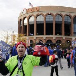 A vendor sells programs and hats outside Citi Field  before Game 4 of the Major League Baseball World Series between the New York Mets and the Kansas City Royals Saturday, Oct. 31, 2015, in New York. (AP Photo/Frank Franklin II)