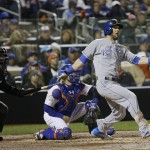 Kansas City Royals' Alex Gordon hits an RBI single during the fifth inning of Game 4 of the Major League Baseball World Series against the New York Mets Saturday, Oct. 31, 2015, in New York. (AP Photo/David J. Phillip)