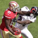 San Francisco 49ers wide receiver Anquan Boldin (81) stiff-arms Baltimore Ravens defensive back Kyle Arrington during the first half of an NFL football game in Santa Clara, Calif., Sunday, Oct. 18, 2015. (AP Photo/Marcio Jose Sanchez)