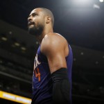 Phoenix Suns center Tyson Chandler walks off the court after being ejected for arguing with referees while facing the Denver Nuggets in the second half of an NBA basketball game Friday, Oct. 16, 2015, in Denver. The Nuggets won 106-81. (AP Photo/David Zalubowski)