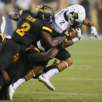 Colorado wide receiver Devin Ross, right, is hit by Arizona State linebacker Christian Sam during the first half of an NCAA college football game, Saturday, Oct. 10, 2015, in Tempe, Ariz. (AP Photo/Matt York)