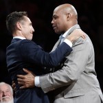 Two-time NBA most valuable player Steve Nash, left, and Charles Barkley talk as Nash is introduced into the Suns Ring of Fire at halftime of an NBA basketball game between the Phoenix Suns and the Portland Trail Blazers, Friday, Oct. 30, 2015, in Phoenix. (AP Photo/Rick Scuteri)