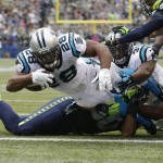 Carolina Panthers running back Jonathan Stewart dives in for a touchdown in the second half of an NFL football game against the Seattle Seahawks, Sunday, Oct. 18, 2015, in Seattle. (AP Photo/Elaine Thompson)