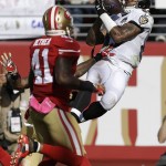 Baltimore Ravens wide receiver Steve Smith, right, catches a touchdown pass in front of San Francisco 49ers strong safety Antoine Bethea (41) and cornerback Kenneth Acker, hidden, during the second half of an NFL football game in Santa Clara, Calif., Sunday, Oct. 18, 2015. (AP Photo/Ben Margot)