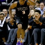 Phoenix Suns' Brandon Knight signals three against the Dallas Mavericks during the first half of an NBA basketball game, Wednesday, Oct. 28, 2015, in Phoenix. (AP Photo/Matt York)