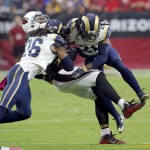Arizona Cardinals tight end Jermaine Gresham (84) is hit by St. Louis Rams strong safety Mark Barron (26) and cornerback Janoris Jenkins (21) during the first half of an NFL football game, Sunday, Oct. 4, 2015, in Glendale, Ariz. (AP Photo/Rick Scuteri)