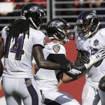 Baltimore Ravens wide receiver Steve Smith, right, celebrates after catching a touchdown pass from quarterback Joe Flacco, center, during the second half of an NFL football game against the San Francisco 49ers in Santa Clara, Calif., Sunday, Oct. 18, 2015. Also pictured is wide receiver Marlon Brown (14). (AP Photo/Ben Margot)