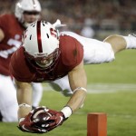 Stanford's Christian McCaffrey lunges into the end zone for a touchdown against Arizona during the first half of an NCAA college football game Saturday, Oct. 3, 2015, in Stanford, Calif. (AP Photo/Marcio Jose Sanchez)