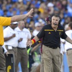 Arizona State head coach Todd Graham, right, gestures to one of his coaches during the first half of an NCAA college football game against UCLA, Saturday, Oct. 3, 2015, in Pasadena, Calif. (AP Photo/Mark J. Terrill)