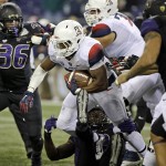 Arizona running back Jared Baker carries against Washington in the first half an NCAA college football game Saturday, Oct. 31, 2015, in Seattle. (AP Photo/Elaine Thompson)