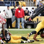 Pittsburgh Steelers free safety Mike Mitchell (23) tumbles after he intercepted a pass intended for Arizona Cardinals wide receiver John Brown (12) in the fourth quarter of an NFL football game, Sunday, Oct. 18, 2015 in Pittsburgh. The Steelers won 25-13. (AP Photo/Gene J. Puskar)