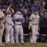 New York Mets infielders wait for relief pitcher Addison Reed to warm up during the eighth inning of Game 2 of the Major League Baseball World Series against the Kansas City Royals Wednesday, Oct. 28, 2015, in Kansas City, Mo. (AP Photo/Matt Slocum)