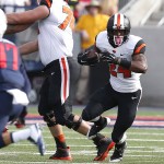 Oregon State running back Storm Woods (24) runs the ball against Arizona during the second half of an NCAA college football game, Saturday, Oct. 10, 2015, in Tucson, Ariz. (AP Photo/Rick Scuteri)