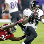 Baltimore Ravens wide receiver Steve Smith (89) makes a catch as Arizona Cardinals cornerback Patrick Peterson (21) defends during the first half of an NFL football game, Monday, Oct. 26, 2015, in Glendale, Ariz. (AP Photo/Rick Scuteri)