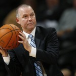 Denver Nuggets head coach Michael Malone catches the ball as it goes out of play against the Phoenix Suns in the second half of an NBA basketball game Friday, Oct. 16, 2015, in Denver. The Nuggets won 106-81. (AP Photo/David Zalubowski)