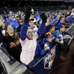Fans cheer during batting practice before Game 4 of the Major League Baseball World Series between the New York Mets and Kansas City Royals Saturday, Oct. 31, 2015, in New York. (AP Photo/David J. Phillip)