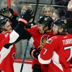 Ottawa Senators' Cody Ceci, center, celebrates his goal with teammates Mark Stone (61) and Kyle Turris (7) during the second period of an NHL hockey game against the Arizona Coyotes in Ottawa, Ontario, Saturday, Oct. 24, 2015. (Fred Chartrand /The Canadian Press via AP) MANDATORY CREDIT