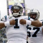 Carolina Panthers quarterback Cam Newton (1) reacts after he rushed for a touchdown in the first half of an NFL football game against the Seattle Seahawks, Sunday, Oct. 18, 2015, in Seattle. (AP Photo/Elaine Thompson)