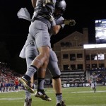 Colorado wide receiver Shay Fields, front, celebrates his touchdown catch with tight end Sean Irwin in the first half of an NCAA college football game against Arizona, Saturday, Oct. 17, 2015, in Boulder, Colo. (AP Photo/David Zalubowski)