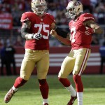San Francisco 49ers offensive tackle Alex Boone (75) and quarterback Colin Kaepernick (7) react during the second half of an NFL football game against the Baltimore Ravens in Santa Clara, Calif., Sunday, Oct. 18, 2015. (AP Photo/Marcio Jose Sanchez)