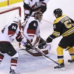 Boston Bruins right wing Jimmy Hayes (11) scores on Arizona Coyotes goalie Mike Smith (41) during the second period of an NHL hockey game in Boston, Tuesday, Oct. 27, 2015. (AP Photo/Charles Krupa)
