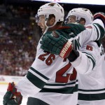 Minnesota Wild's Thomas Vanek (26), of Austria, celebrates his goal against the Arizona Coyotes with Marco Scandella, right, during the first period of an NHL hockey game Thursday, Oct. 15, 2015, in Glendale, Ariz. (AP Photo/Ross D. Franklin)