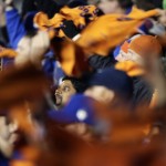Fans cheer before the start of Game 4 of the Major League Baseball World Series between the Kansas City Royals and the New York Mets Saturday, Oct. 31, 2015, in New York. (AP Photo/Charlie Riedel)