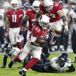 Arizona Cardinals running back Chris Johnson (23) runs for a touchdown against the Baltimore Ravens during the first half of an NFL football game, Monday, Oct. 26, 2015, in Glendale, Ariz. (AP Photo/Rick Scuteri)