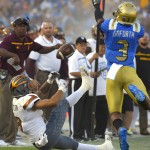 Arizona State wide receiver D.J. Foster, left, can't hold on to a pass as UCLA defensive back Randall Goforth defends during the first half of an NCAA college football game, Saturday, Oct. 3, 2015, in Pasadena, Calif. Goforth was charged with pass interference on the play. (AP Photo/Mark J. Terrill)