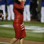 Singer-songwriter Demi Lovato leaves the infield after singing the national anthem before Game 4 of the Major League Baseball World Series between the New York Mets and Kansas City Royals Saturday, Oct. 31, 2015, in New York. (AP Photo/Matt Slocum)