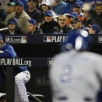 New York Mets pitcher Noah Syndergaard, left, watches Kansas City Royals' Alcides Escobar in the warm-up circle during the second inning of Game 4 of the Major League Baseball World Series Saturday, Oct. 31, 2015, in New York. (AP Photo/Matt Slocum)