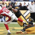Pittsburgh Steelers outside linebacker James Harrison (92) blocks Arizona Cardinals wide receiver John Brown (12) after Pittsburgh Steelers free safety Mike Mitchell (23) intercepted a pass in the fourth quarter of an NFL football game, Sunday, Oct. 18, 2015, in Pittsburgh. Harrison was given an unnecessary roughness penalty on the play. (AP Photo/Gene J. Puskar)