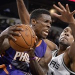 Phoenix Suns guard Eric Bledsoe, left, is defended by San Antonio Spurs forward Tim Duncan during the first half of a preseason NBA basketball game, Tuesday, Oct. 20, 2015, in San Antonio. (AP Photo/Darren Abate)