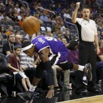 Sacramento Kings' Rajon Rondo (9) loses the ball out of bounds as referee Pat Fraher, right, looks on during the first half of an NBA preseason basketball game against the Phoenix Suns, Wednesday, Oct. 7, 2015, in Phoenix. (AP Photo/Ross D. Franklin)