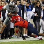 Colorado wide receiver Shay Fields, left, is knocked out of play by Arizona cornerback Cam Denson after catching a pass in the first half of an NCAA college football game Saturday, Oct. 17, 2015, in Boulder, Colo. (AP Photo/David Zalubowski)