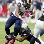 St. Louis Rams running back Todd Gurley (30) is hit by Arizona Cardinals strong safety Deone Bucannon (20) during the first half of an NFL football game, Sunday, Oct. 4, 2015, in Glendale, Ariz. (AP Photo/Rick Scuteri)