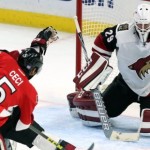 Ottawa Senators' Cody Ceci (5) shoots and scores on Arizona Coyotes goaltender Anders Lindback (29) during the second period of an NHL hockey game in Ottawa, Ontario, Saturday, Oct. 24, 2015. (Fred Chartrand /The Canadian Press via AP) MANDATORY CREDIT