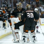 Anaheim Ducks goalie Anton Khudobin (30) is replaced by Frederik Andersen, left, during the first period of an NHL hockey game against the Arizona Coyotes in Anaheim, Calif., Wednesday, Oct. 14, 2015. (AP Photo/Christine Cotter)