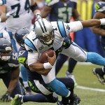 Carolina Panthers quarterback Cam Newton is tackled by Seattle Seahawks outside linebacker Mike Morgan (57) in the second half of an NFL football game, Sunday, Oct. 18, 2015, in Seattle. (AP Photo/Stephen Brashear)