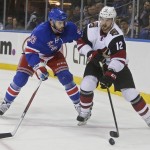 New York Rangers' Keith Yandle (93) defends Arizona Coyotes' Brad Richardson (12) during the first period of an NHL hockey game Thursday, Oct. 22, 2015, in New York. (AP Photo/Frank Franklin II)