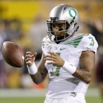 Oregon's Vernon Adams Jr. catches the football as he warms up prior to an NCAA college football game against Arizona State Thursday, Oct. 29, 2015, in Tempe, Ariz. (AP Photo/Ross D. Franklin)