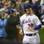 New York Mets' Michael Conforto smiles after hitting a home run during the fifth inning of Game 4 of the Major League Baseball World Series against the Kansas City Royals Saturday, Oct. 31, 2015, in New York. (AP Photo/David J. Phillip)