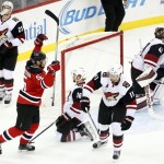 New Jersey Devils defenseman Adam Larsson (5), of Sweden, celebrates after scoring the game-winning goal against the Arizona Coyotes during overtime of an NHL hockey game, Tuesday, Oct. 20, 2015, in Newark, N.J. The Devils won 3-2 in overtime. (AP Photo/Julio Cortez)