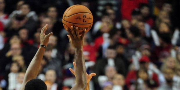 Phoenix Suns guard Brandon Knight (3) hits a three-point shot over Portland Trail Blazers guard C.J...