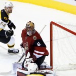 Boston Bruins' Tyler Randell (64) gets a shot past Arizona Coyotes' Mike Smith (41) for a goal during the second period of an NHL hockey game Saturday, Oct. 17, 2015, in Glendale, Ariz. (AP Photo/Ross D. Franklin)