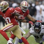 San Francisco 49ers cornerback Kenneth Acker (20) runs with an interception in front of Baltimore Ravens tight end Maxx Williams (87) during the second half of an NFL football game in Santa Clara, Calif., Sunday, Oct. 18, 2015. (AP Photo/Ben Margot)